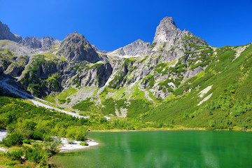 Fototapeta na wymiar Beautiful summer landscape. Mountain lake Zelene pleso in National Park High Tatra. Slovakia, Europe.