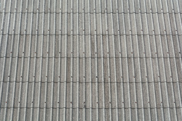 Bright gray pattern of old roof in sunny day.