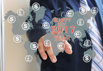 2017 happy new year. Businessman pressing 2017 on the touch screen with the world map. Business innovation,business vision , webinar, startup in 2017.