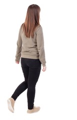 side view of walking  woman in jeans. beautiful girl in motion.  backside view of person.  Rear view people collection. Isolated over white background.