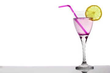 magenta martini cocktail in glass on with lemon and tubule white background