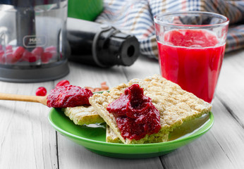 cornel jam on gallet and glass of mors Juice .Blender cloth defocused second plan. selective focus © vania_zhukevych