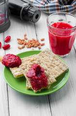 cornel jam on gallet and glass of mors Juice .Blender cloth defocused second plan. selective focus © vania_zhukevych