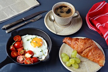 Fried egg and coffee breakfast, top view 