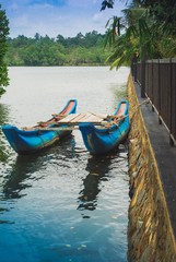 blue fishing boat on lake in Sri Lanka