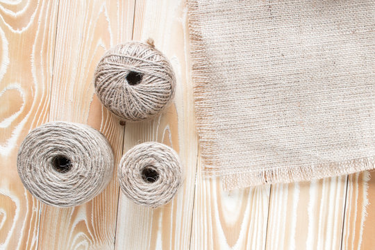 hank jute yarns with sackcloth on wooden table top view
