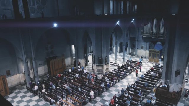MANIZALES, COLOMBIA - CIRCA MAY 2016: People on the nave of the cathedral of Manizales from the balcony praying during mass. 4k
