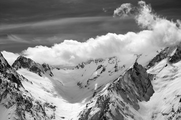 Obraz premium Black and white winter mountains in clouds