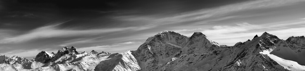 Black and white panorama of winter mountains