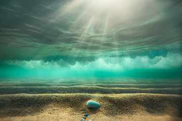 Underwater background with sandy sea bottom