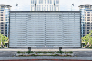 Large blank billboard on a street wall, banners with room to add your own text