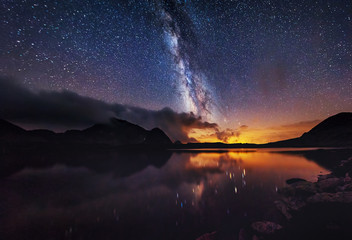 Milky way on over the mountain lake - Powered by Adobe