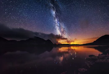 Gordijnen Milky way on over the mountain lake © ValentinValkov