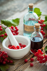 Bottle of Guelder rose (Red Viburnum) tincture and mortar 