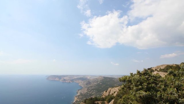 summer landscape of mountains stretching out into the sea