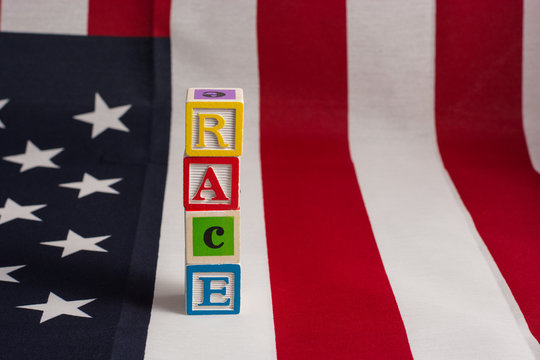 Race In America!  Race Spelled Out On Top Of An American Flag.  