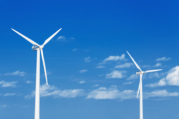 Energy windmill produce energy on blue sky at daytime