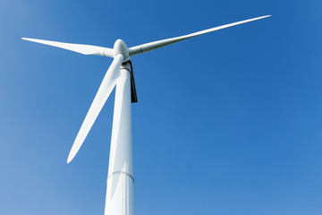 Energy windmill produce energy on blue sky at daytime