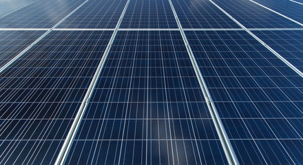 Solar panels generate power energy on blue sky at daytime