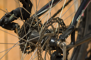 Fototapeta na wymiar Closeup detailed look at bicycle wheel gear shifting mechanics during maintenance repairs
