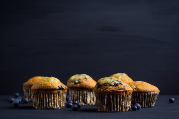 Homemade muffins with strawberries on the wooden background. Selective focus.