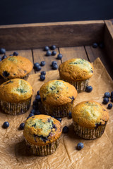 Homemade muffins with strawberries on the wooden background. Selective focus.