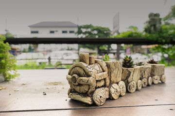 flower pot made of cement as stone train with tree in it in garden