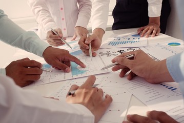 Group of business peopleworking with papers together