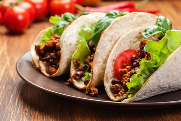 Mexican tacos with minced meat, beans and spices