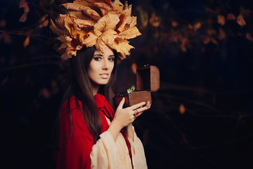 Autumn Woman Holding Treasure Box with Big Diamond