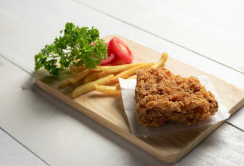 fried chicken with fries on a plate