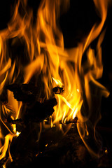 Fire flames on a black background. Blaze fire flame texture back