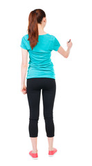 back view of writing beautiful woman. Young girl in sweatpants. Rear view people collection. ...