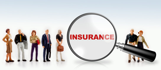 people with the word insurance in a magnifying glass - insurance concept