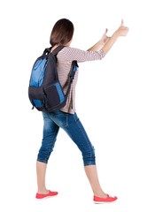 Back view of brunette woman with backpack thumbs up.  girl shows ok sign . Rear view people collection.  backside view of person.  Isolated over white background.

