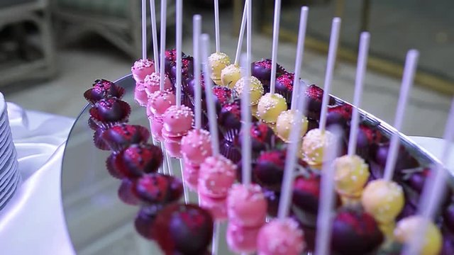 delicious decorated candy bar, sweets on tables for wedding reception