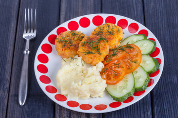 vegan food. carrot cutlets with mashed potatoes and vegetables close up