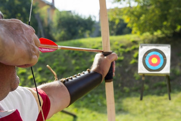 Medieval archer shoot at a target