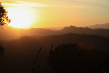 Sun-rising behind the Himalayas in Kasauli, Himachal Pradesh, India at Dawn. Kasauli (Hindi: कसौली) is a cantonment and town, located in Solan district in the Indian state of Himachal Pradesh. 