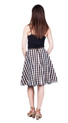 back view of standing young beautiful  woman.  brunette girl in red dress and  kitten heels watching. Rear view people collection.  backside view of person.  Isolated over white background.