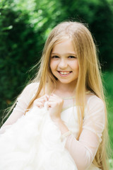 small girl in white dress outdoor