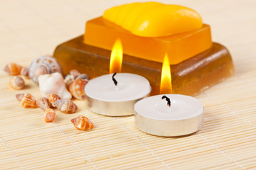 Fototapeta na wymiar candles, soap and sea shells