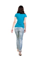 Obraz premium back view of walking woman in jeans . beautiful brunette girl in motion. backside view of person. Rear view people collection. Isolated over white background.