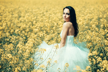 pretty wedding girl in yellow field flowers