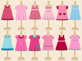 Vector set of children's dresses on mannequins.