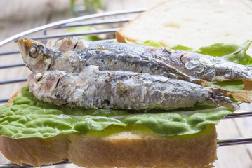 Sandwich Kamut, tapas with sardines, sprats with olives and herb