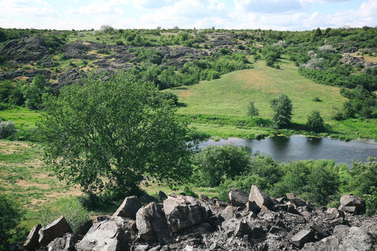 Green hills under blue sky