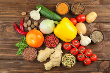 Vegetables and spices on wooden table