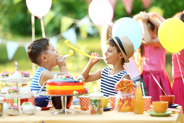 Children celebrating birthday in park