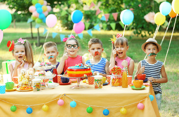 Children celebrating birthday in park